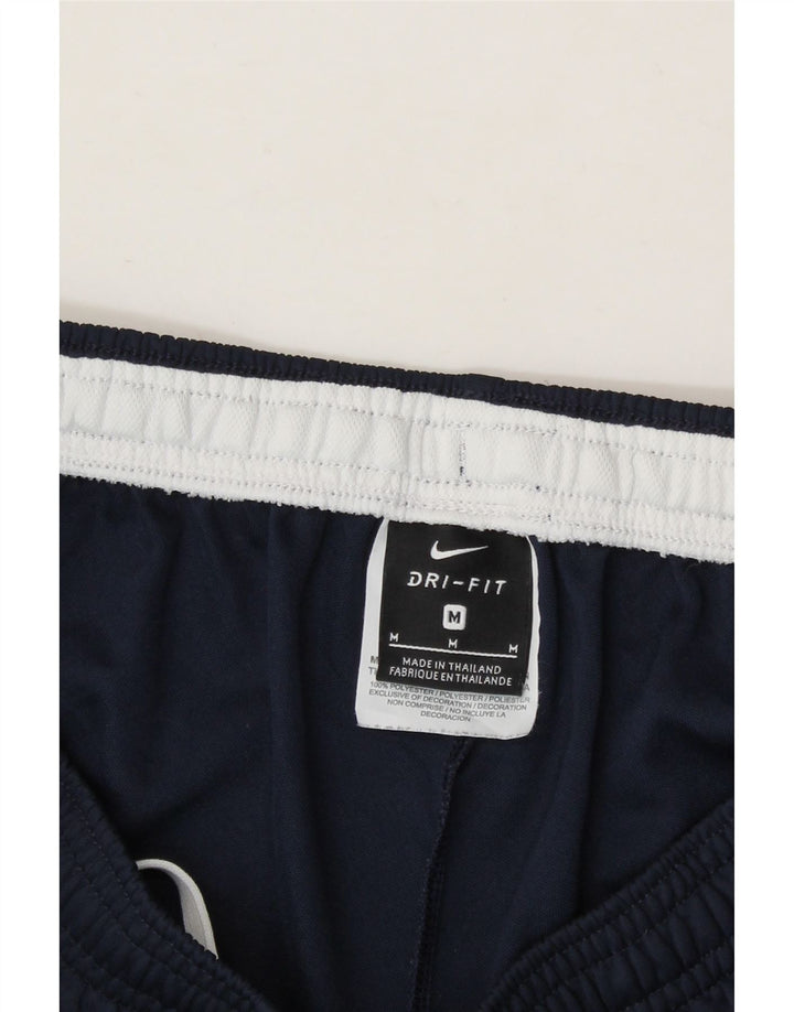 NIKE Mens Tracksuit Trousers Medium  Navy Blue Colourblock Polyester Vintage Nike and Second-Hand Nike from Messina Hembry 