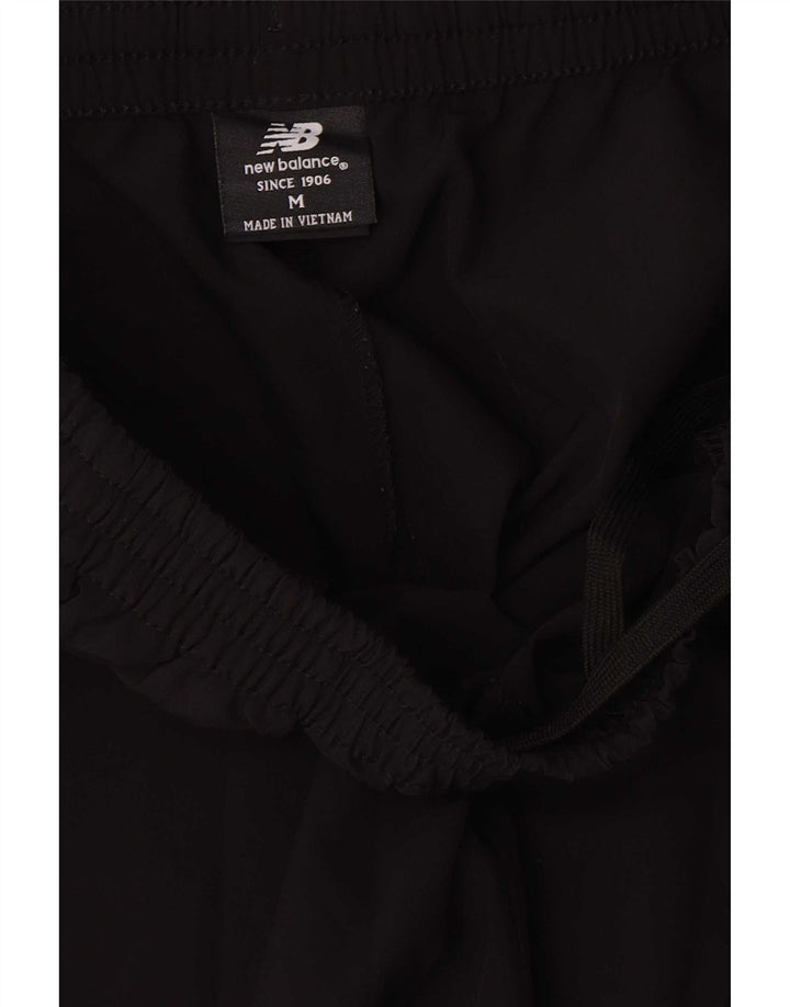 Pantaloni da tuta da donna New Balance UK 14 poliestere nero medio
