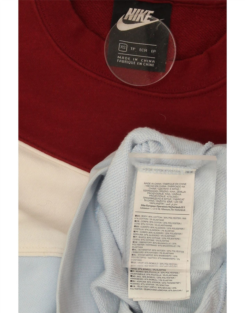 NIKE Womens Oversized Crop Sweatshirt Jumper UK 6 XS Blue Colourblock Vintage Nike and Second-Hand Nike from Messina Hembry 